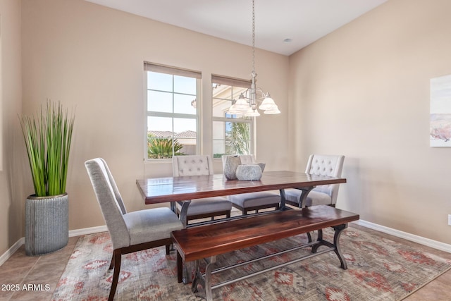 dining space featuring light tile patterned flooring and baseboards