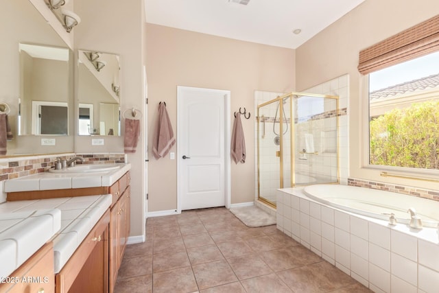 full bathroom featuring backsplash, a shower stall, a bath, and tile patterned floors