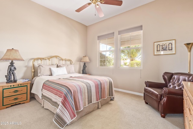 bedroom featuring light carpet, ceiling fan, and baseboards