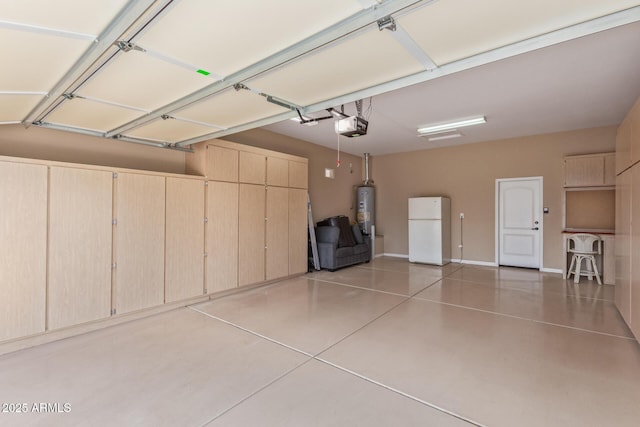 garage with water heater, baseboards, freestanding refrigerator, and a garage door opener