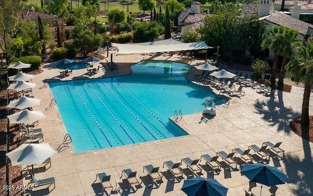 community pool featuring a patio area