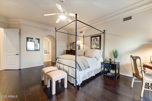 bedroom with ceiling fan, dark hardwood / wood-style floors, and crown molding