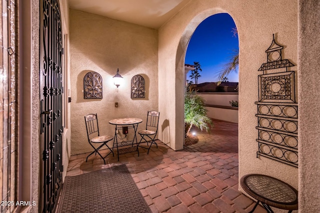 view of patio terrace at dusk