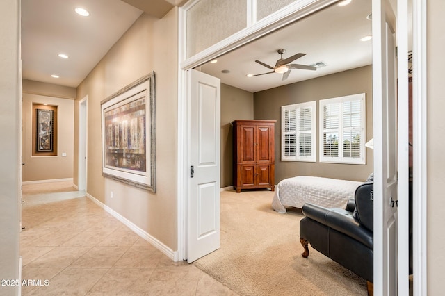 bedroom with light colored carpet and ceiling fan