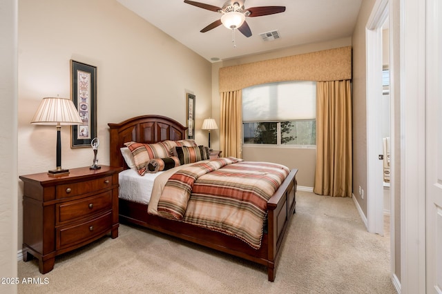 carpeted bedroom featuring ceiling fan and vaulted ceiling