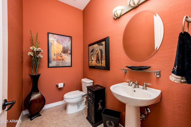 bathroom with sink and toilet