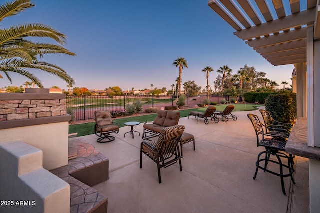 patio terrace at dusk with a pergola