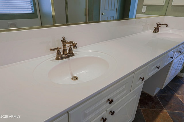 bathroom with double vanity and a sink