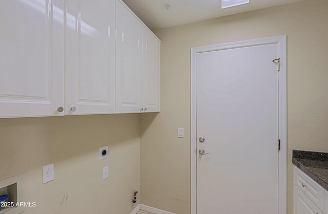 laundry room featuring cabinet space, hookup for an electric dryer, and baseboards