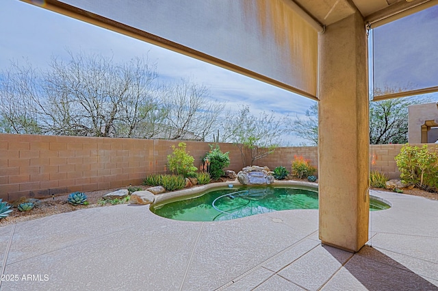 view of swimming pool featuring a fenced backyard, a fenced in pool, and a patio area