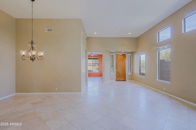 spare room with baseboards, visible vents, a notable chandelier, and recessed lighting