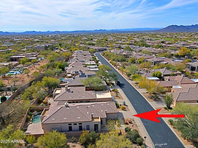 birds eye view of property with a residential view and a mountain view