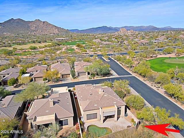 drone / aerial view featuring a residential view and a mountain view