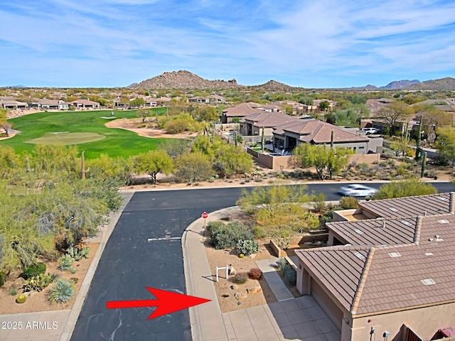 drone / aerial view featuring a mountain view and a residential view