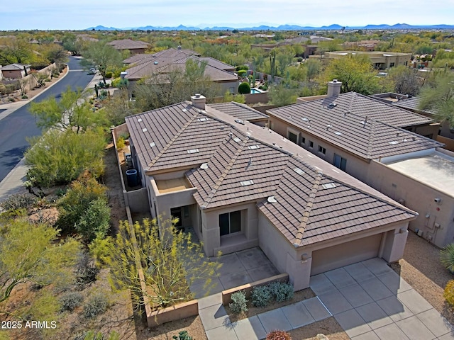 birds eye view of property featuring a mountain view