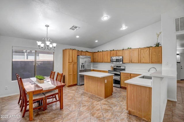 kitchen with light countertops, visible vents, appliances with stainless steel finishes, and a sink