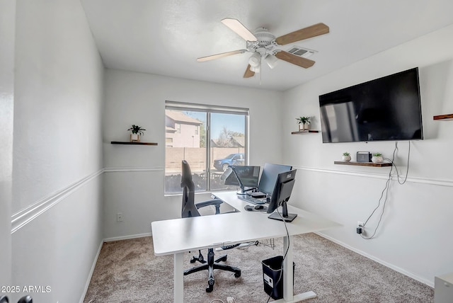 home office featuring carpet flooring, ceiling fan, baseboards, and visible vents