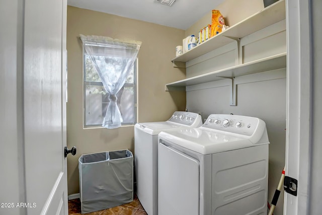 laundry area featuring visible vents, separate washer and dryer, and laundry area