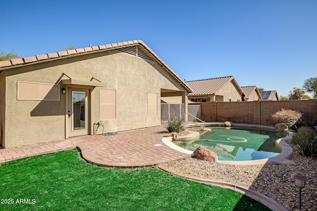 view of swimming pool featuring a patio, a fenced backyard, and a fenced in pool