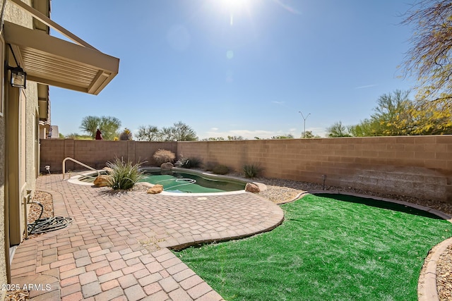 view of yard featuring a patio and a fenced backyard