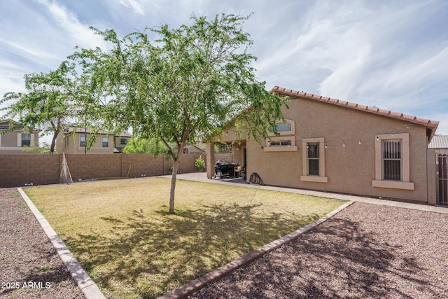 2889 S 161st Dr, Goodyear, AZ 85338 - view of yard featuring a patio area and a fenced backyard
