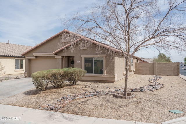 2889 S 161st Dr, Goodyear, AZ 85338 - view of front facade with stucco siding, a garage, concrete driveway, and fence