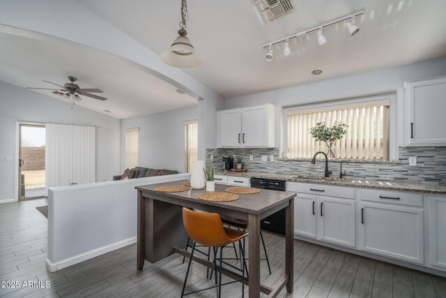 2889 S 161st Dr, Goodyear, AZ 85338 - kitchen featuring dishwashing machine, a ceiling fan, visible vents, a sink, and vaulted ceiling