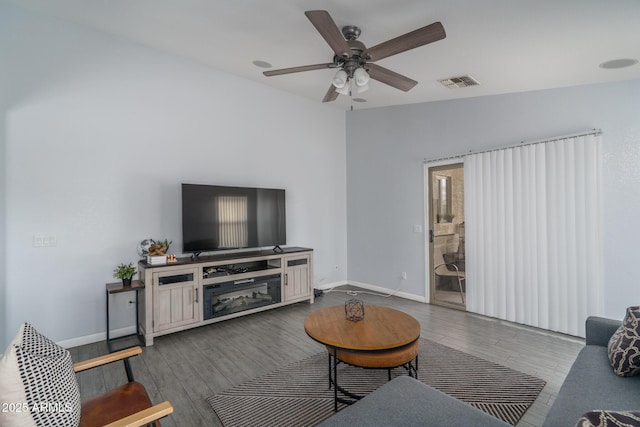 2889 S 161st Dr, Goodyear, AZ 85338 - living area featuring visible vents, baseboards, wood finished floors, and a ceiling fan