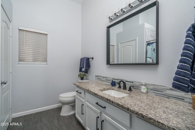 2889 S 161st Dr, Goodyear, AZ 85338 - bathroom featuring baseboards, toilet, wood finished floors, and vanity