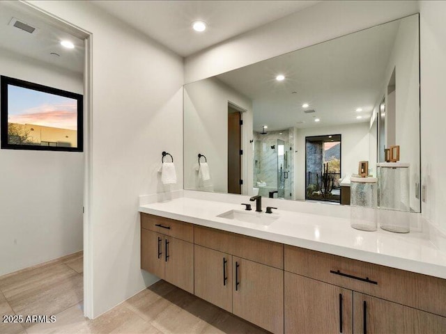 bathroom with vanity and walk in shower