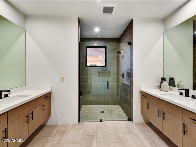 bathroom featuring walk in shower and vanity