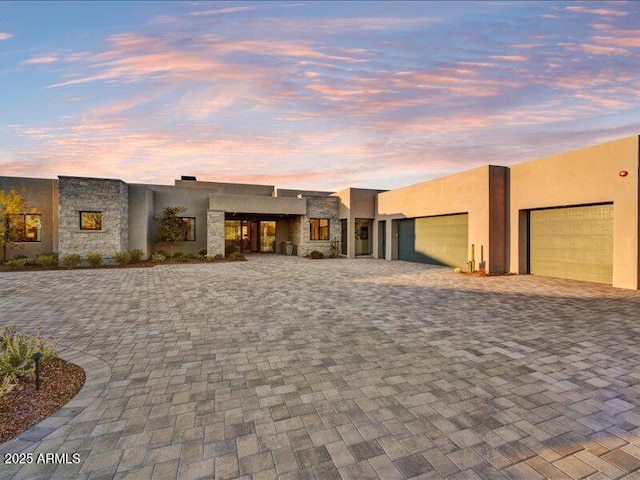 adobe home featuring a garage