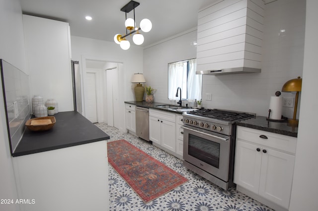 kitchen featuring stainless steel appliances, sink, ventilation hood, decorative light fixtures, and white cabinets