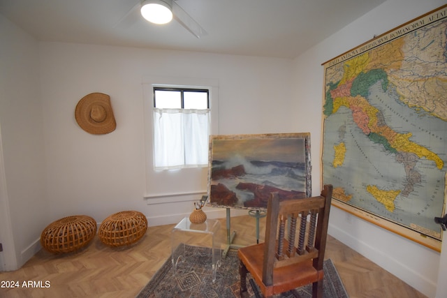 sitting room featuring parquet flooring