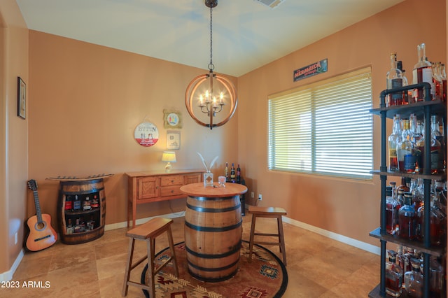 dining area featuring an inviting chandelier