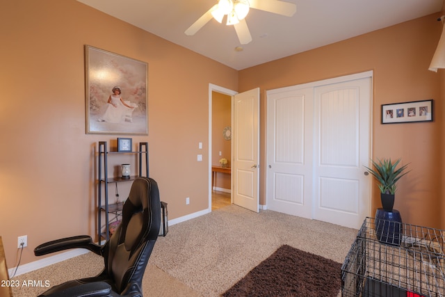 home office featuring carpet flooring and ceiling fan