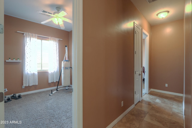 hall featuring light colored carpet