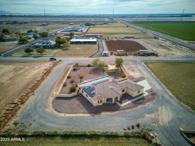 birds eye view of property with a rural view