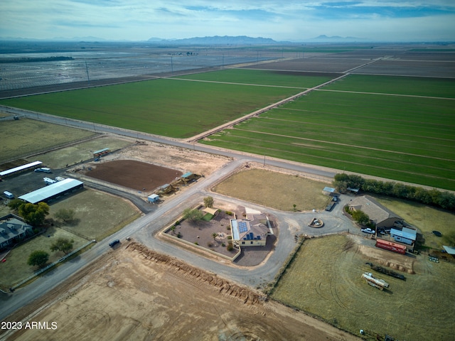 birds eye view of property featuring a mountain view