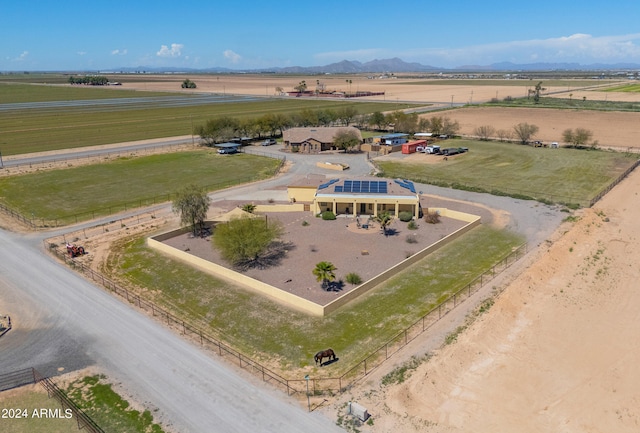 drone / aerial view with a mountain view and a rural view