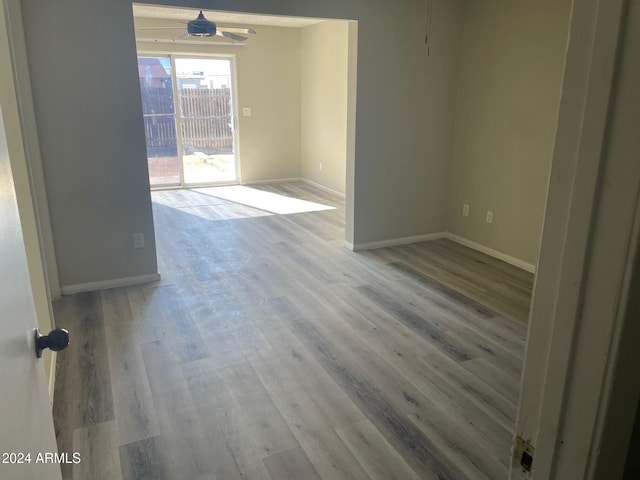 spare room featuring light wood-type flooring and ceiling fan