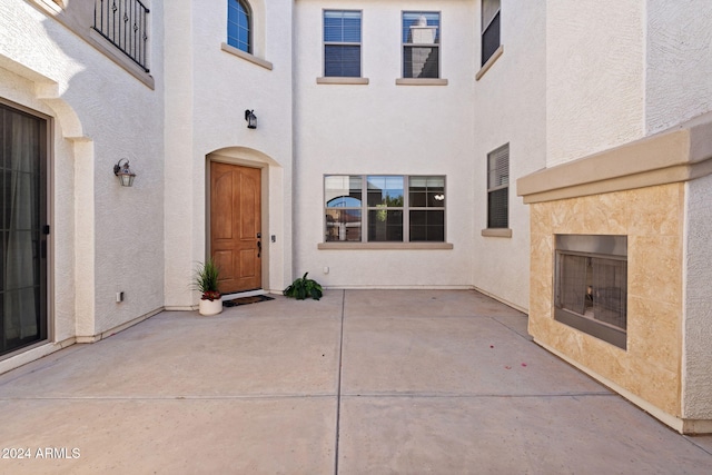 property entrance featuring a patio