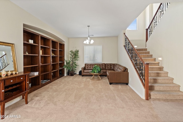 living area featuring light carpet, a healthy amount of sunlight, and an inviting chandelier