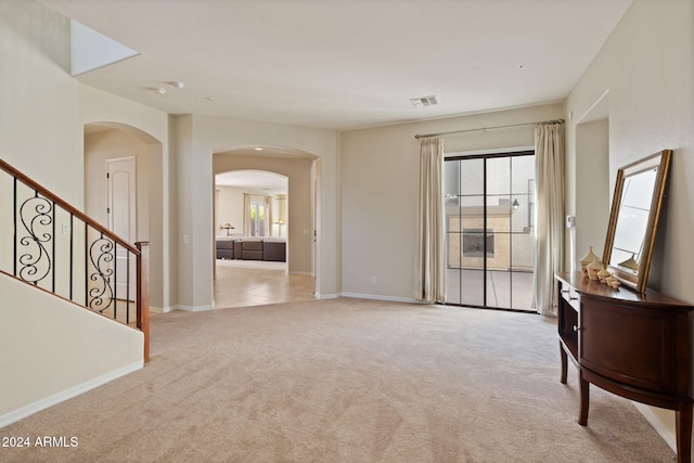 view of carpeted foyer