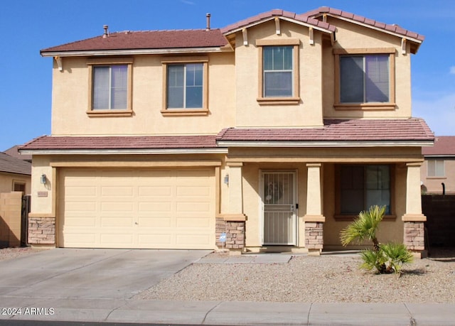 view of front of property featuring a garage and covered porch