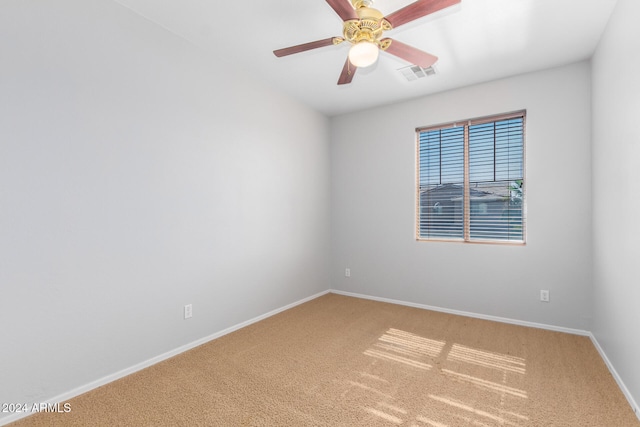 unfurnished room with ceiling fan and carpet flooring