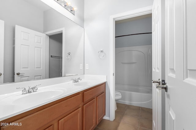 full bathroom with toilet, bathing tub / shower combination, vanity, and tile patterned floors