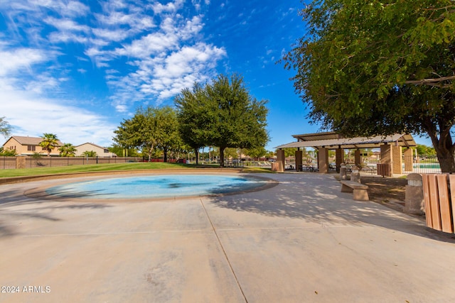 view of swimming pool featuring a patio area