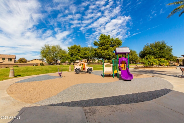 view of jungle gym with a lawn