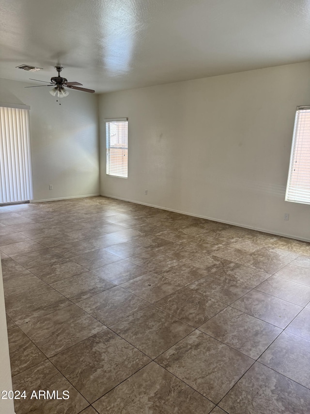 unfurnished room featuring ceiling fan